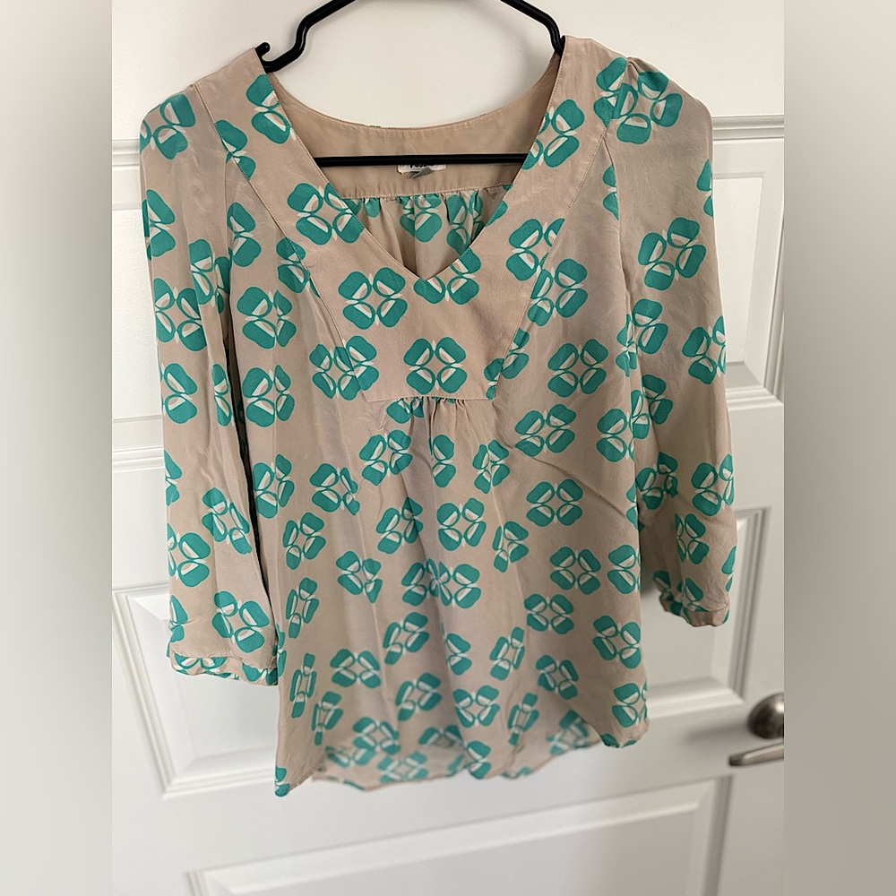 Woman’s everyday casual blouse! Worn a couple of times but in perfect condition!